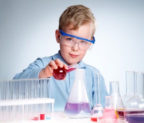 Image young boy playing in laboratorium.
