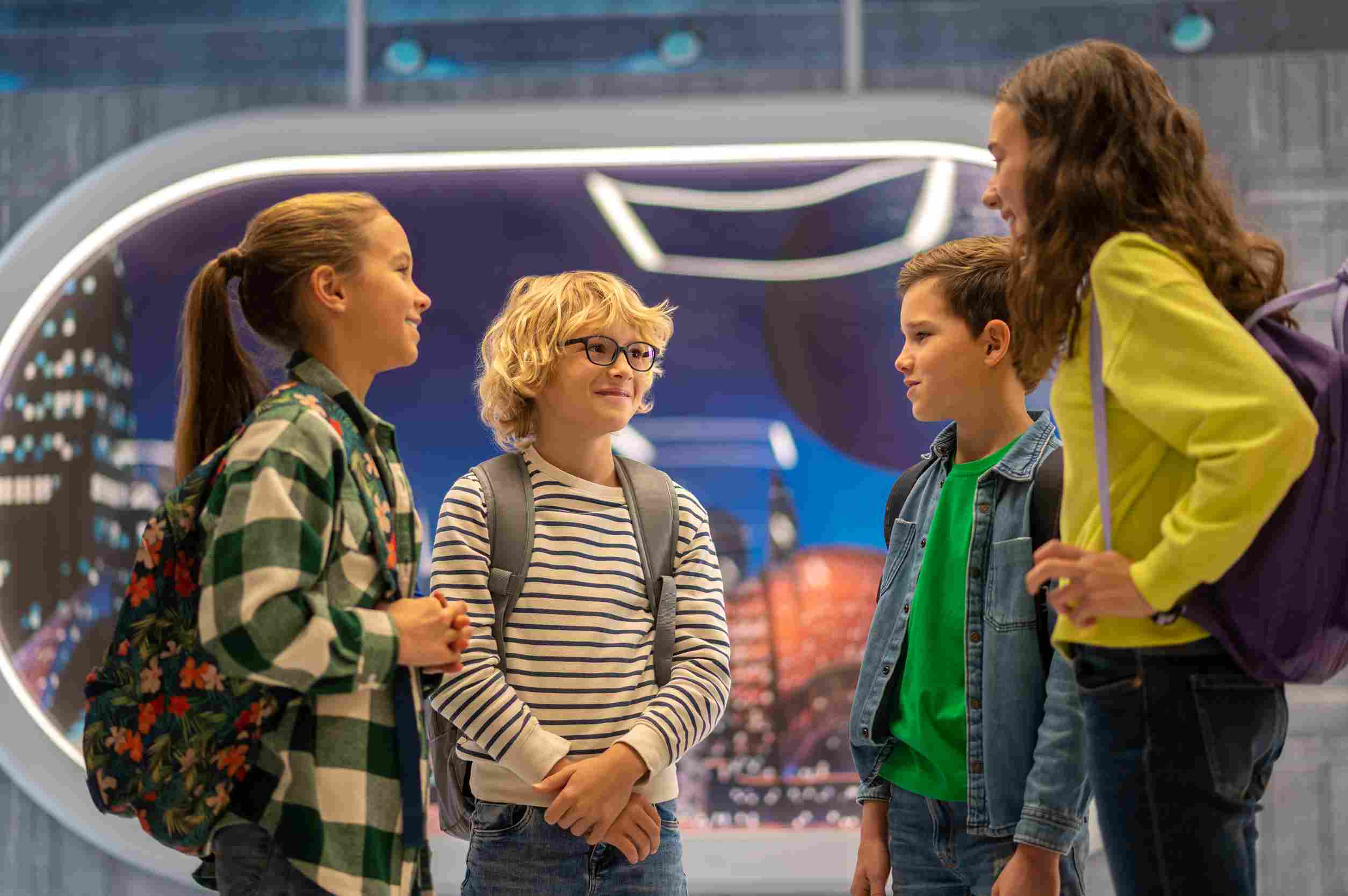 Kids talking at museum.