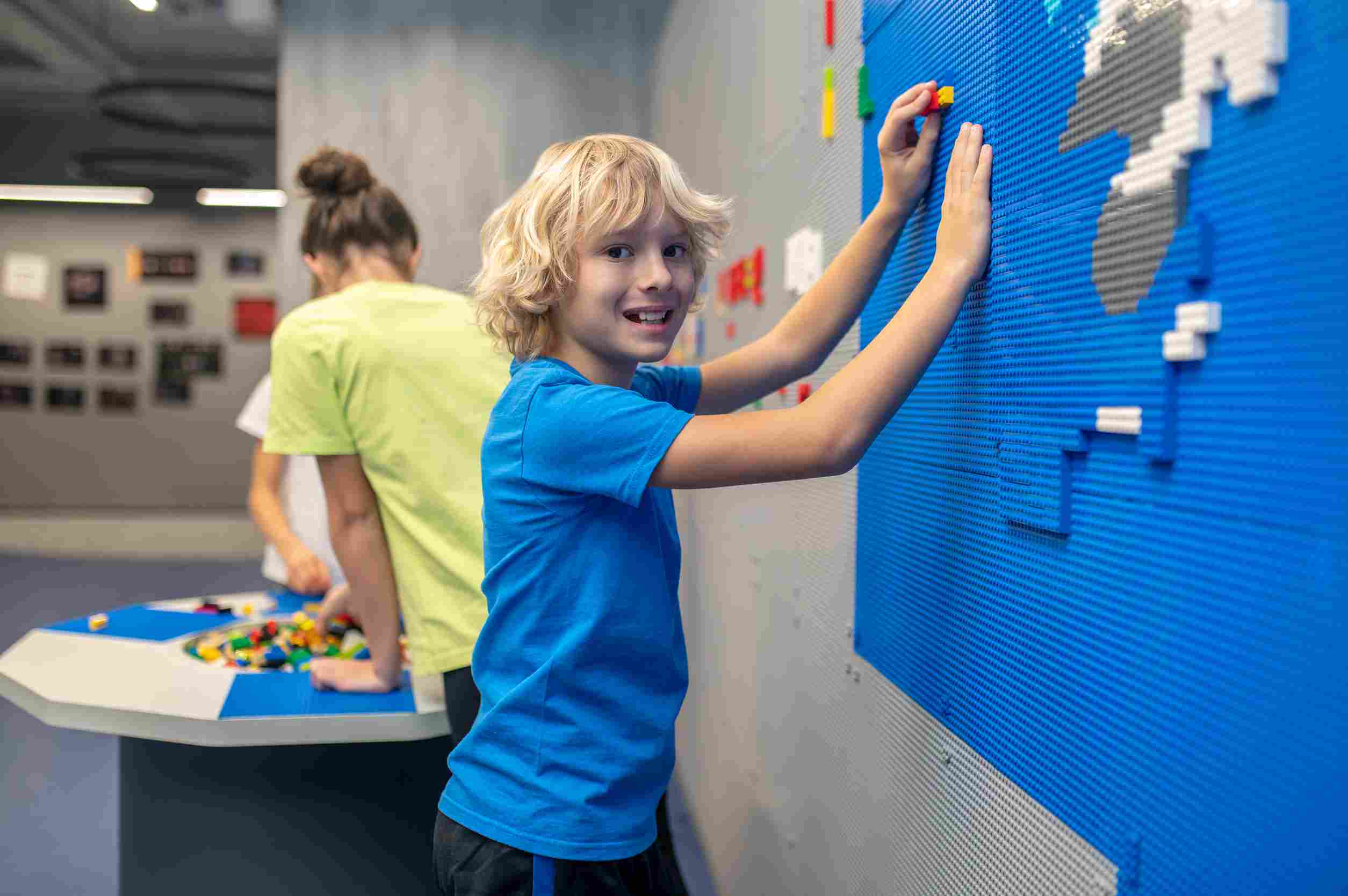 Young boy playing at museum.
